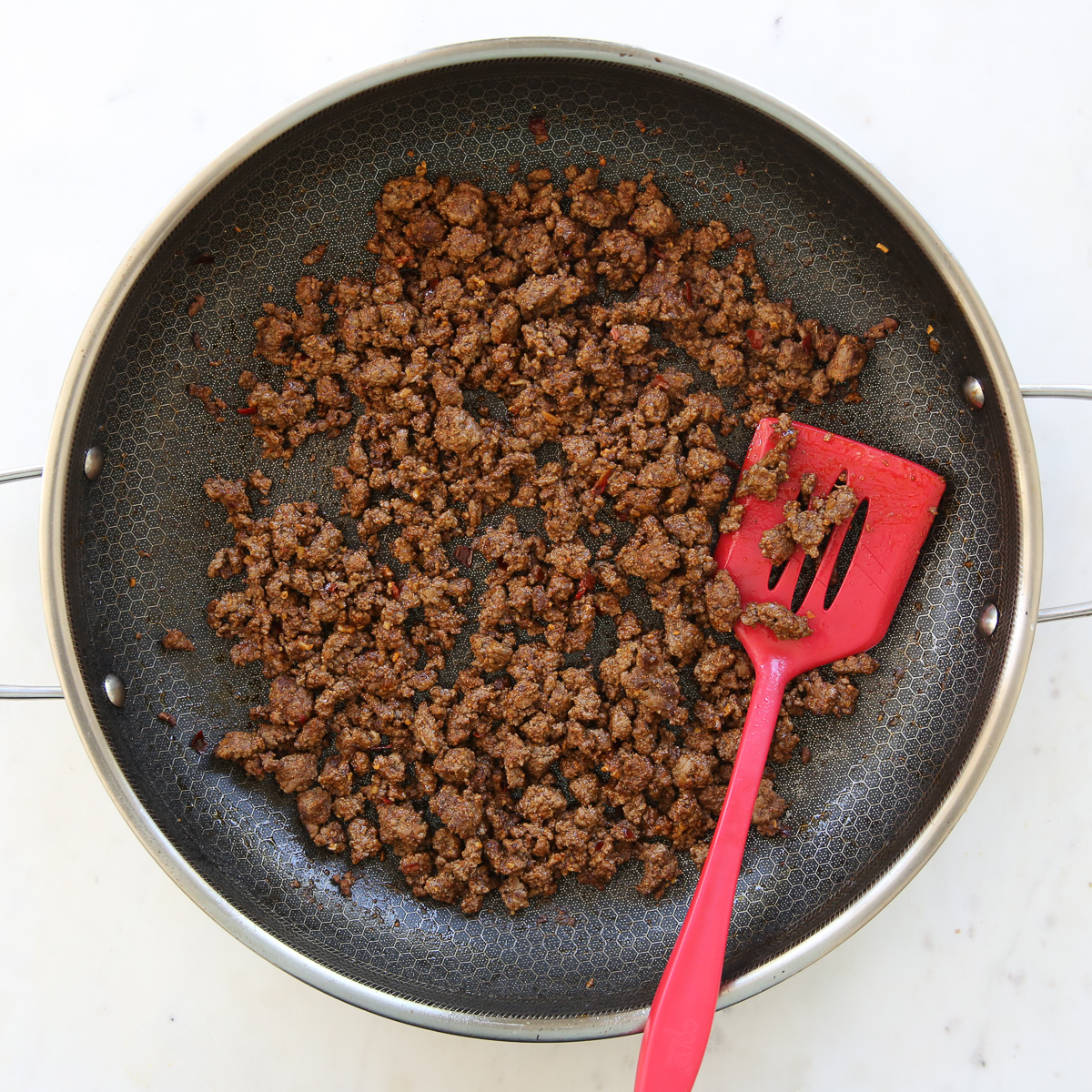 ground beef cooked in a skillet