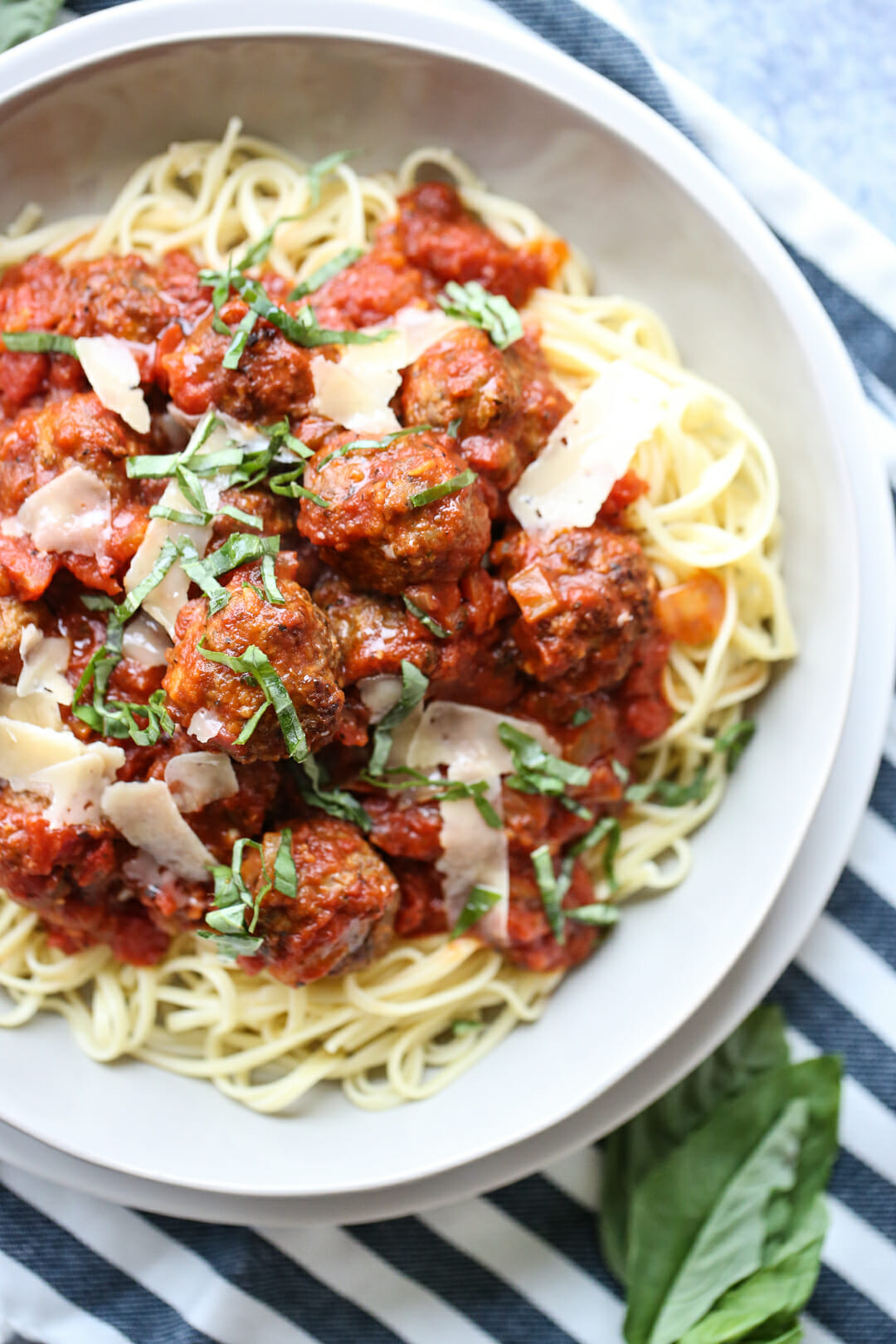 meatballs over noodles on plate