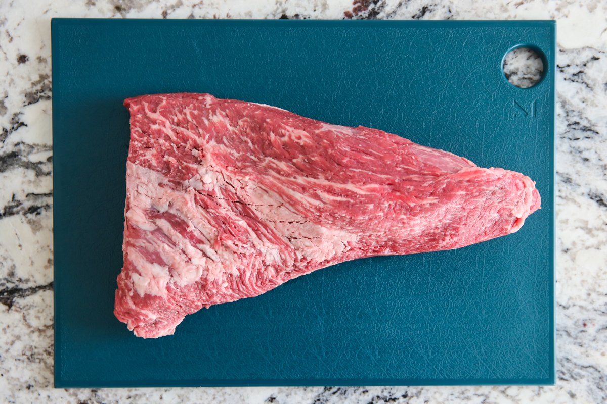 tri tip steak on a cutting board
